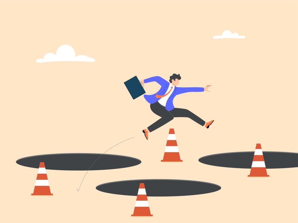 Illustration of a businessperson in a suit jumping over large holes and traffic cones, holding a briefcase, symbolizing overcoming obstacles or challenges in a professional setting.