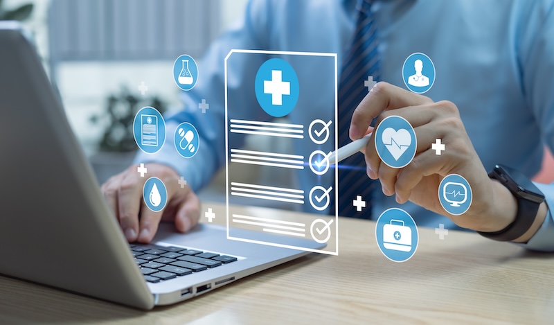 A person uses their laptop to access medical information.